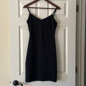 Short low cut black dress with stripe design